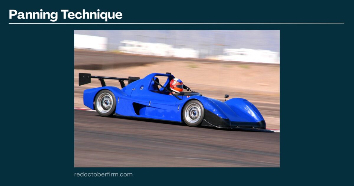 22 Basic Photography Techniques You Need To Level Up! A Blue Race Car Speeds Along A Track, With A Blurred Background Demonstrating The Panning Photography Technique.