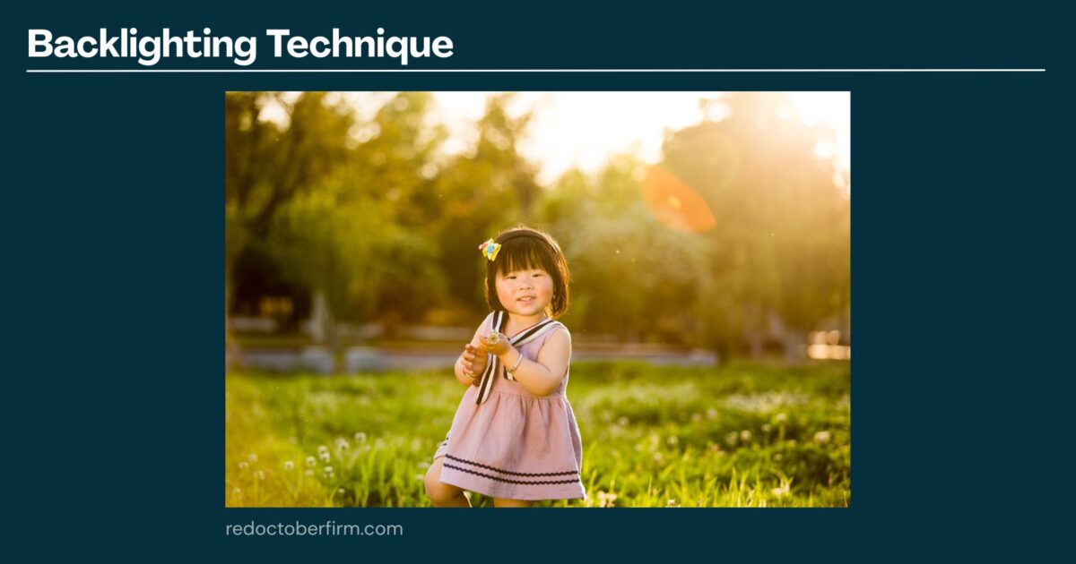 22 Basic Photography Techniques You Need To Level Up! A Young Girl In A Pink Dress Stands On Grass Outdoors, Holding A Flower With Sunlight Behind Her, Demonstrating The Backlighting Photography Technique.
