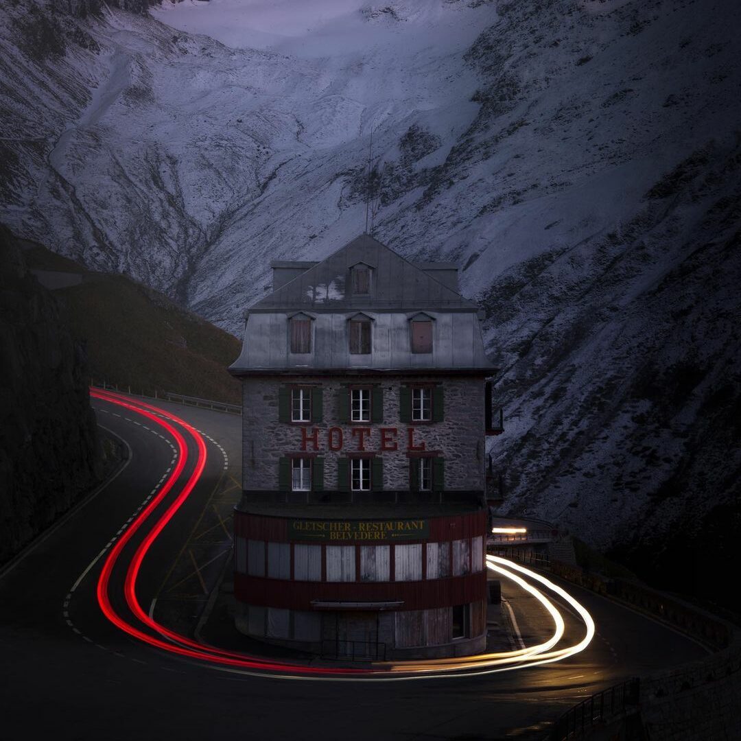 What Is Shutter Speed In Photography? (The Complete Guide) A Photograph Capturing The Effect Of Long Exposure On A Mountain Road, With A Building In The Background.