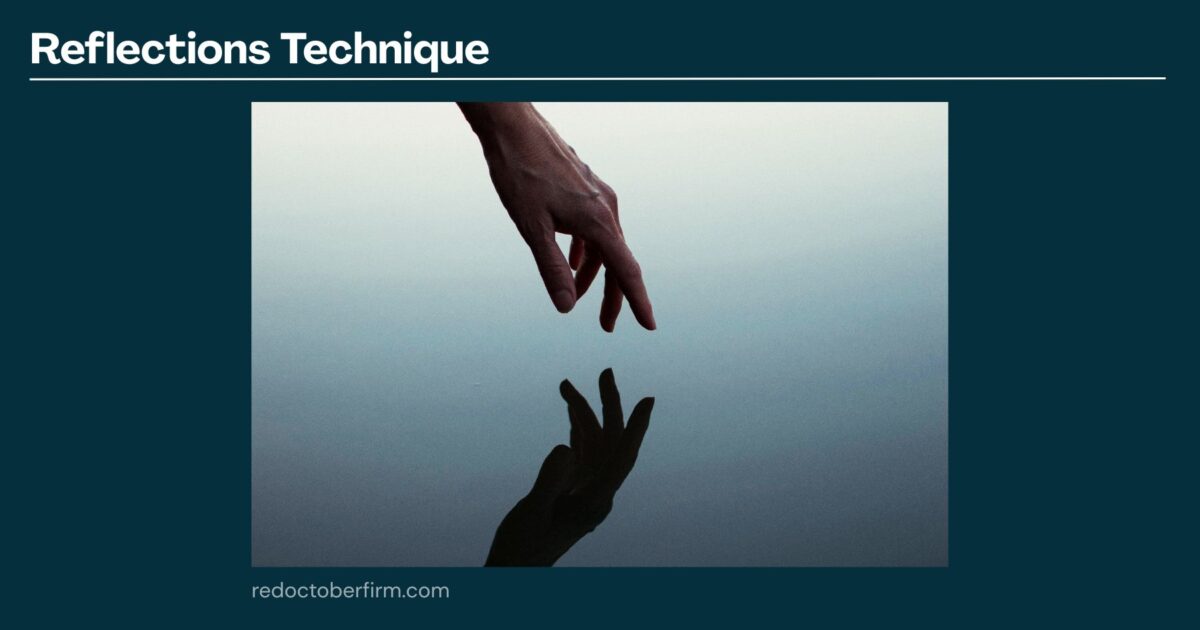 22 Basic Photography Techniques You Need To Level Up! A Hand With Two Fingers Extended Is Held Above Still Water, Creating A Clear Reflection Of The Fingers On The Water’s Surface.