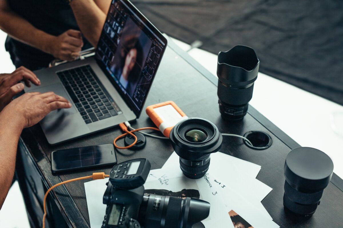 Photo Editing For Beginners (Made Easy) A Group Of People Turn Photos Into Art On A Laptop At A Table.