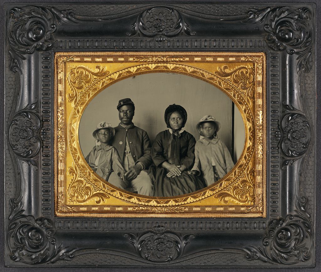 The History Of Photography (Timeline Included) A Family Photo In A Historic Frame.