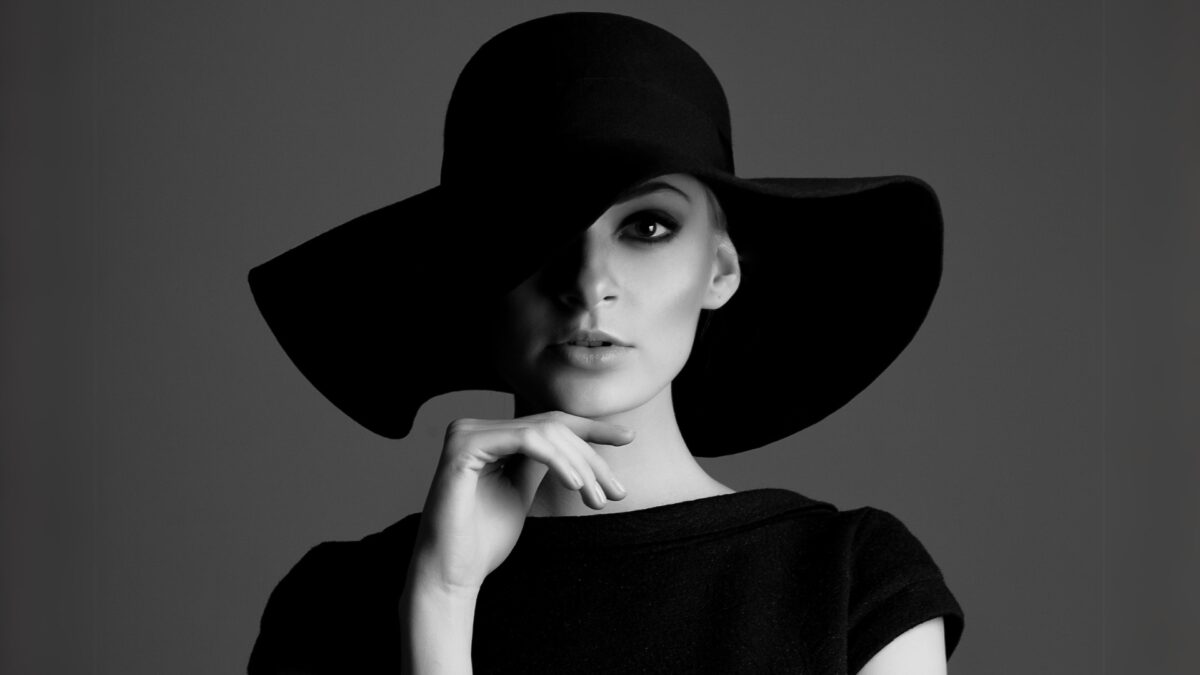 Portrait Photography Tips For Beginners A Black And White Portrait Photo Of A Woman In A Hat, Showcasing Photography Tips For Capturing Striking Portraits.
