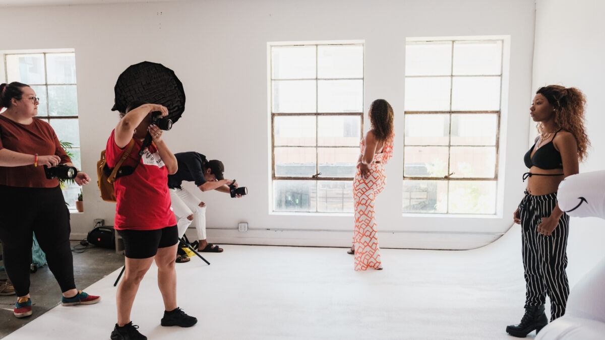 How To Join Photography Groups You'Ll Love A Group Of People Join A Photography Group And Take Pictures In A Studio.