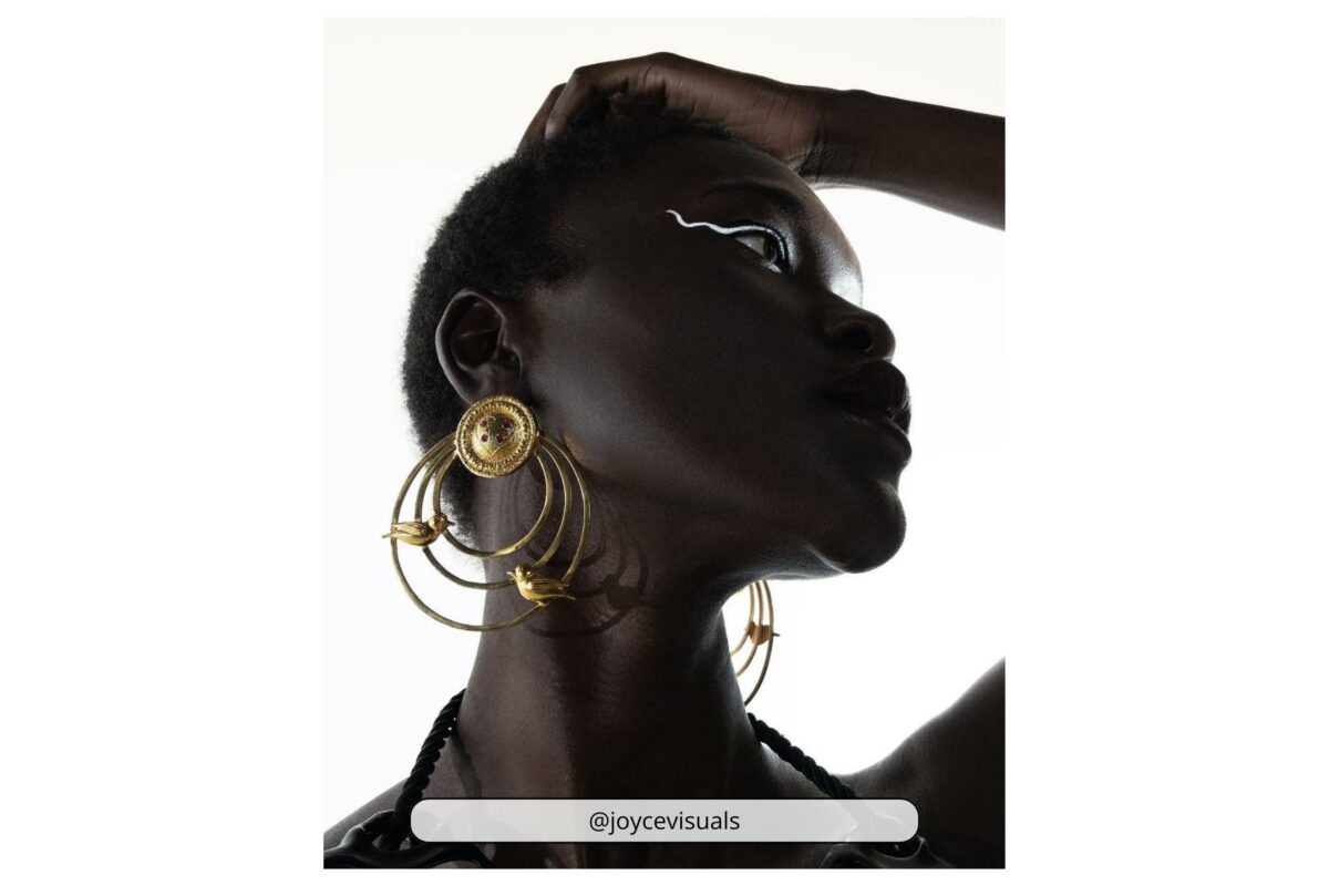 Why Photography Is An Art (My Take Take On The Matter) A Black Woman Wearing Gold Hoop Earrings Poses For A Photography Art Session.