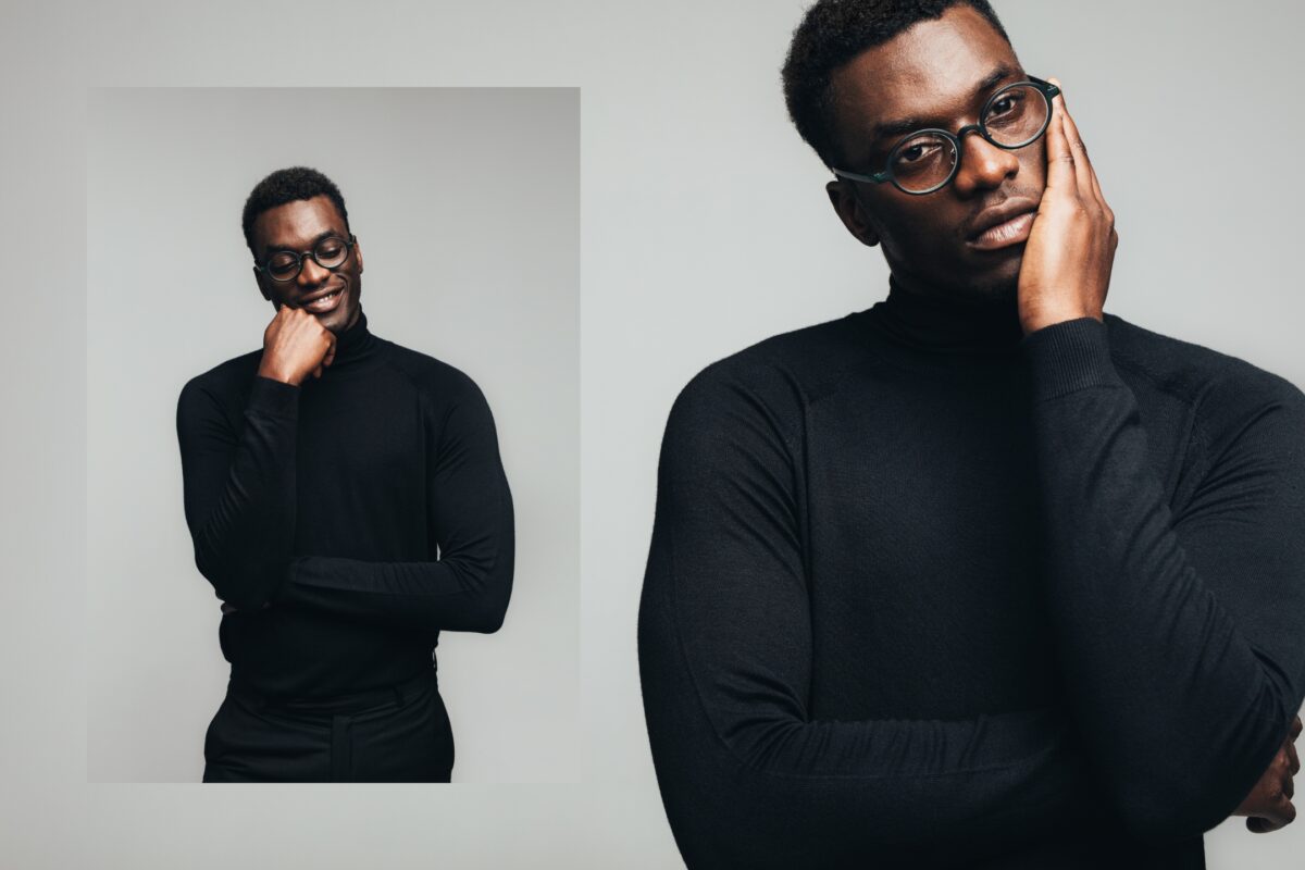 What To Say To Clients During A Photo Session: With Prompts A Stylish Black Man Wearing Glasses And A Black Turtleneck Shirt Who Provides Posing Prompts During A Photo Session.