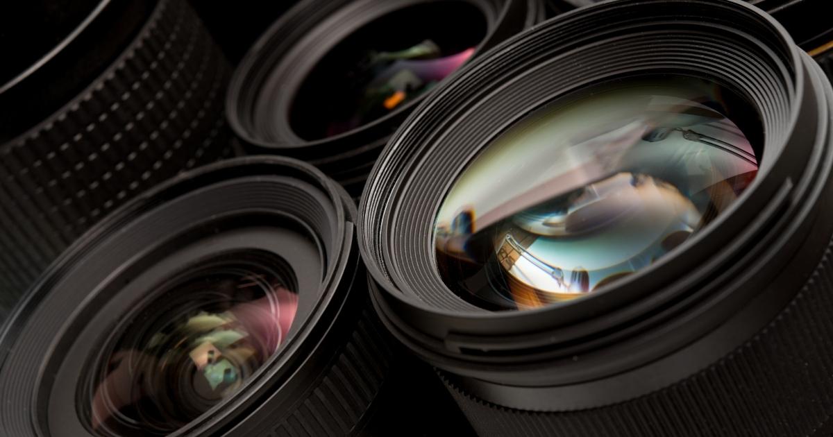 What Is Photography: An Introduction And Quick Guide A Collection Of Camera Lenses On A Dark Background, Showcasing The Essence Of Photography.
