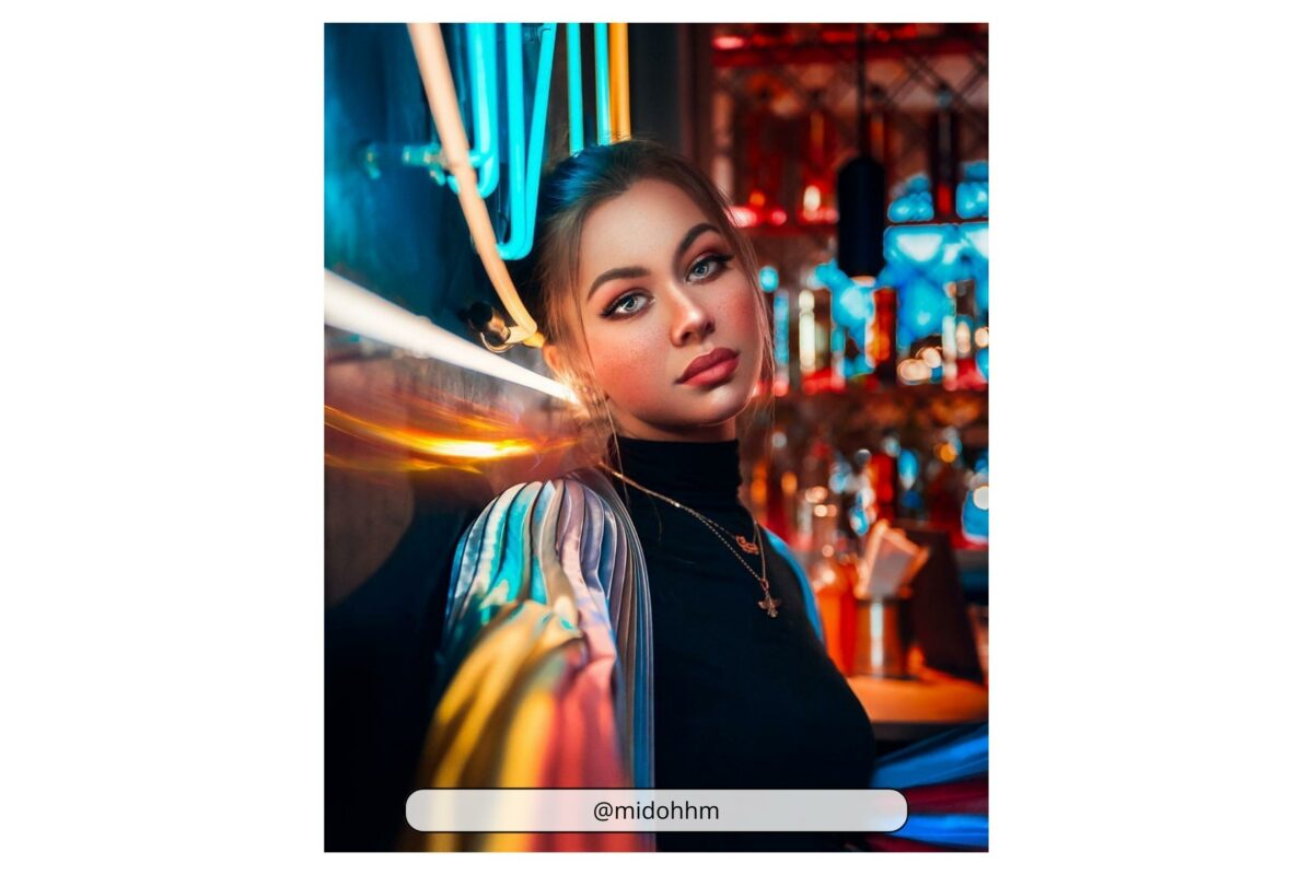 Why Photography Is An Art (My Take Take On The Matter) An Enchanting Woman Captivates Attention As She Gracefully Poses In Front Of A Bar Adorned With Mesmerizing Neon Lights.