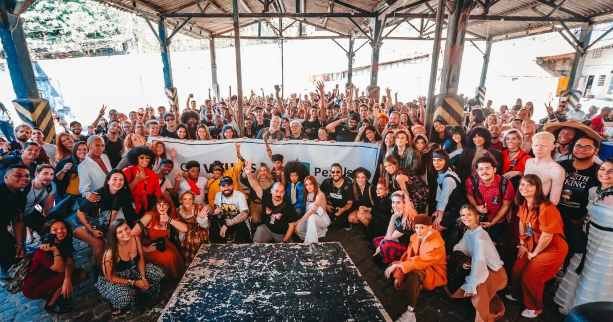 What Is A Photo Essay In Photography (13 Examples You Can Try) A Group Of People Posing For A Photo In A Warehouse, Capturing The Essence Of A Photo Essay.