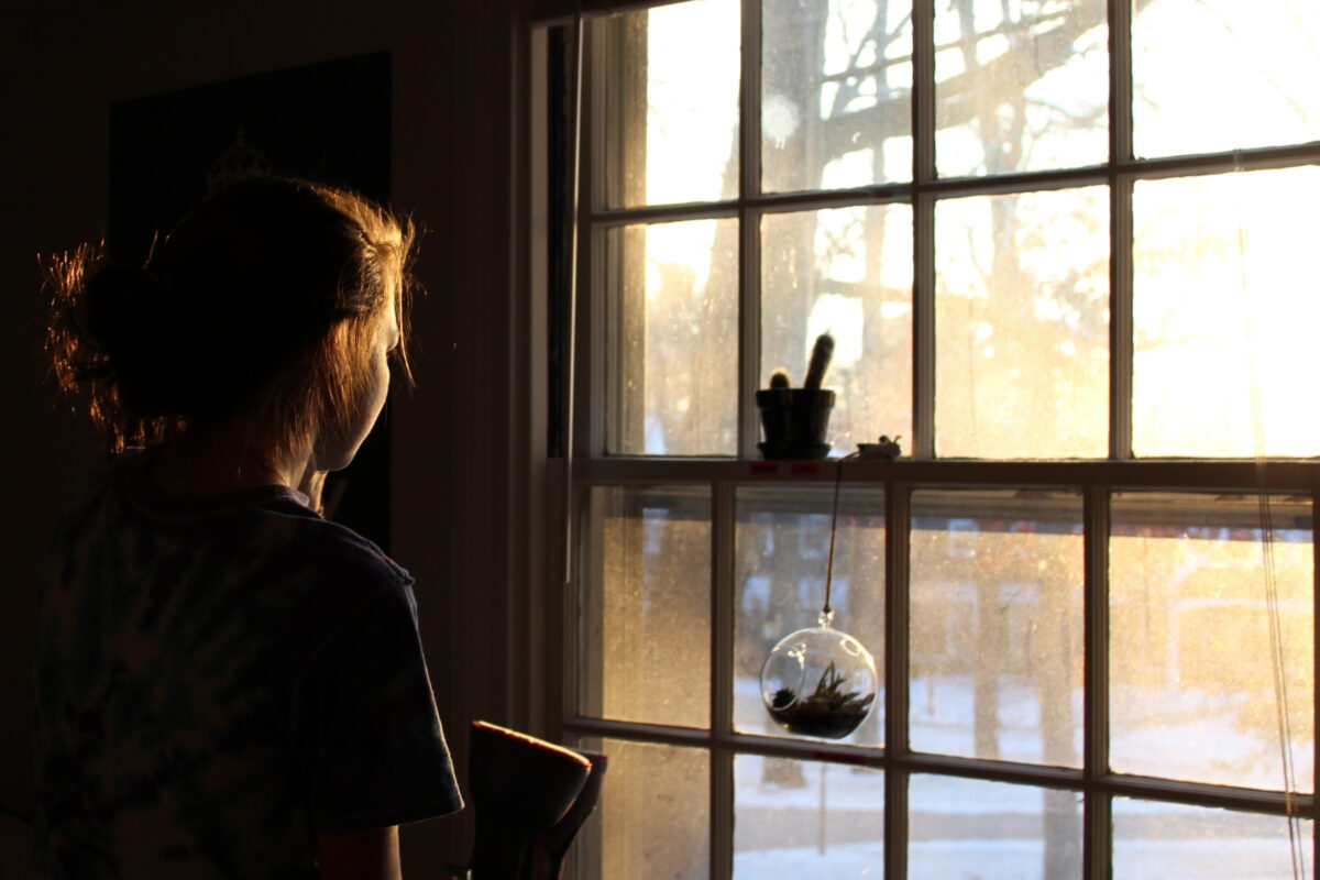 Composition In Photography And What You Need To Know A Girl Framed By A Window, Showcasing A Remarkable Composition In Photography.