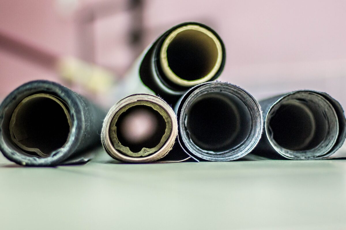 The Complete Guide To Photography Backdrops A Group Of Rolls Of Paper Sitting On A Table, Perfect For Photography Backdrops.