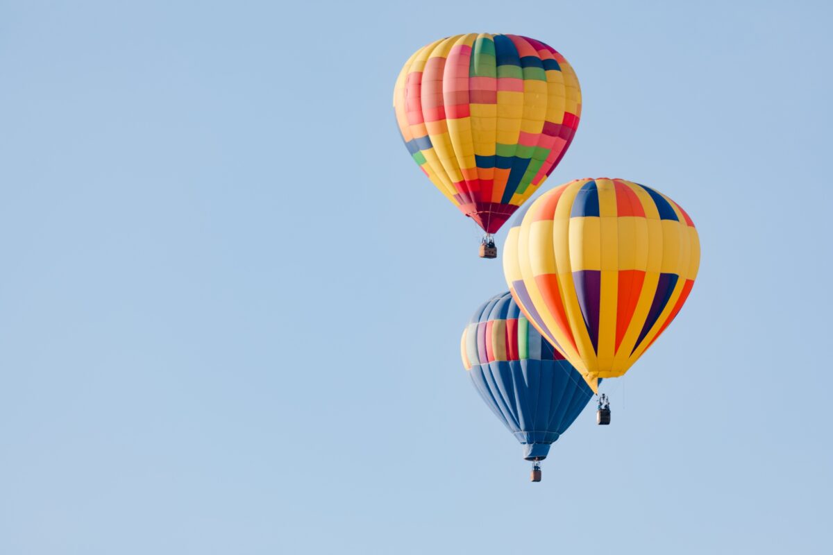 Composition In Photography And What You Need To Know Three Colorful Hot Air Balloons Flying In The Sky Captured In A Stunning Composition In Photography.