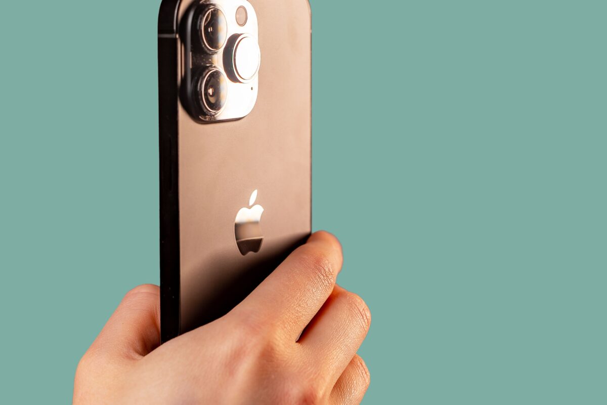 Mobile Photography Tips That'Ll Help You Take Better Photos A Person Experimenting With Mobile Photography Tips, Adeptly Capturing Stunning Shots With Their Iphone 11 Featuring An Attached Camera.