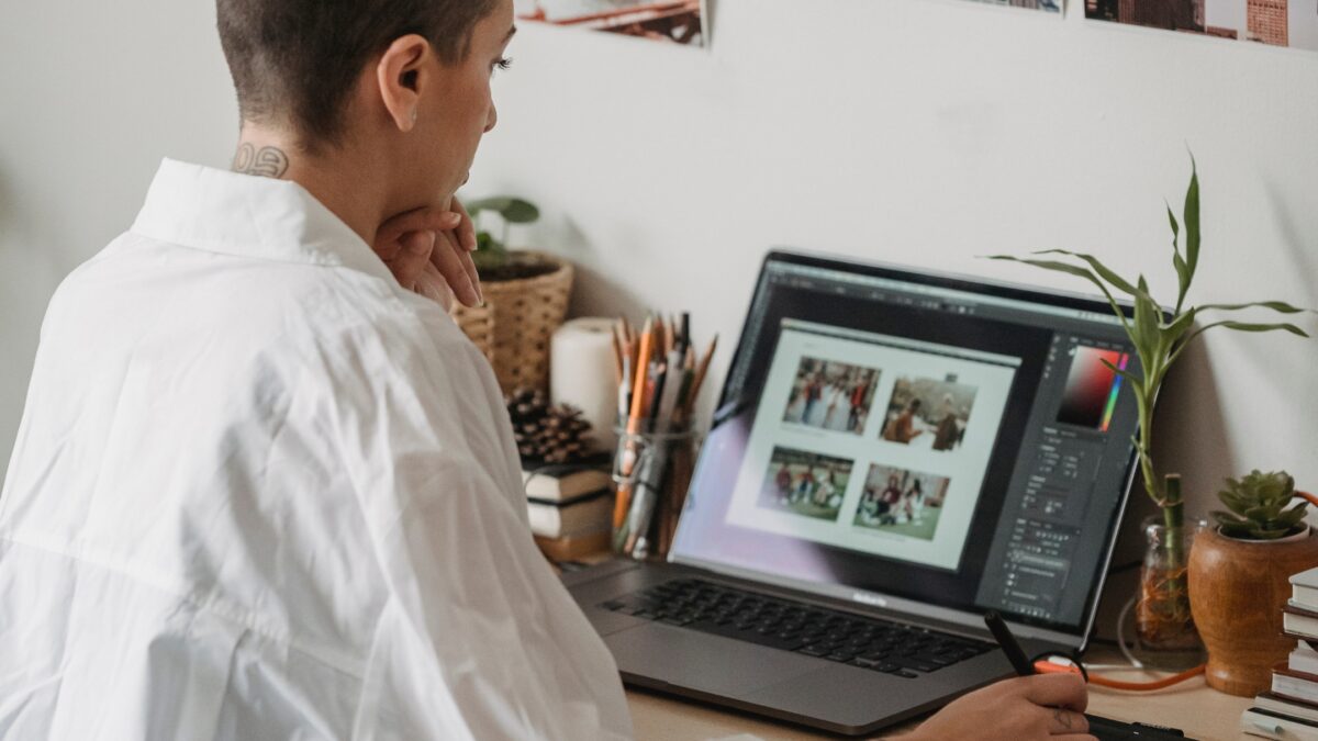 Perfect Indoor Photos And The Camera Settings You'Ll Need A Woman Is Working On Her Laptop, Creating Perfect Indoor Photos At Home.