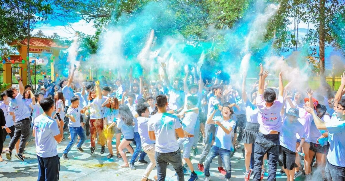 What Is A Photo Essay In Photography (13 Examples You Can Try) A Captivating Photo Essay Capturing A Group Of People Joyfully Throwing Colored Powder In The Air, Showcasing The Artistry And Exuberance Of This Mesmerizing Photography Technique.