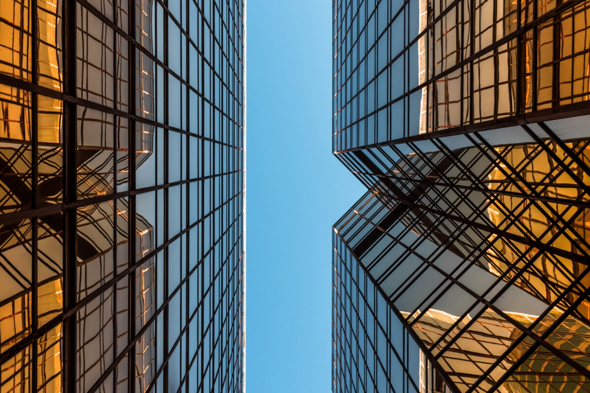 Composition In Photography And What You Need To Know A Composition Of Two Tall Buildings Against A Blue Sky Backdrop.