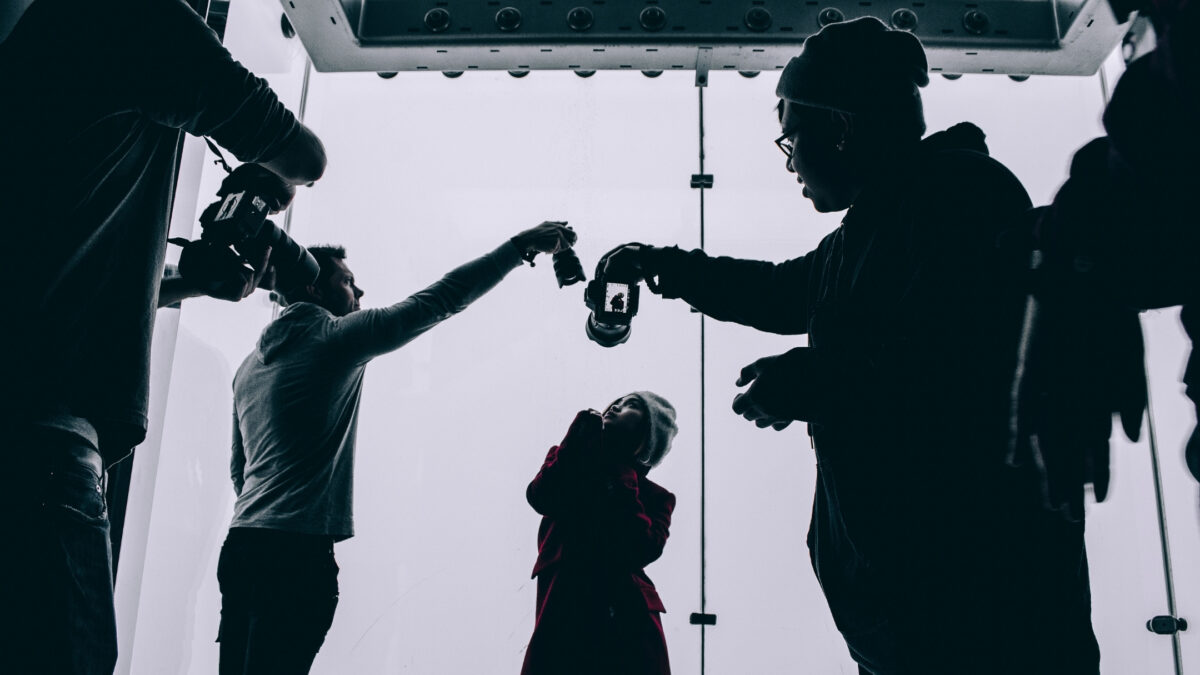 22 Ways To Market Your Photography Business For More Clients A Group Of People Join A Photography Group And Stand In Front Of A Camera.