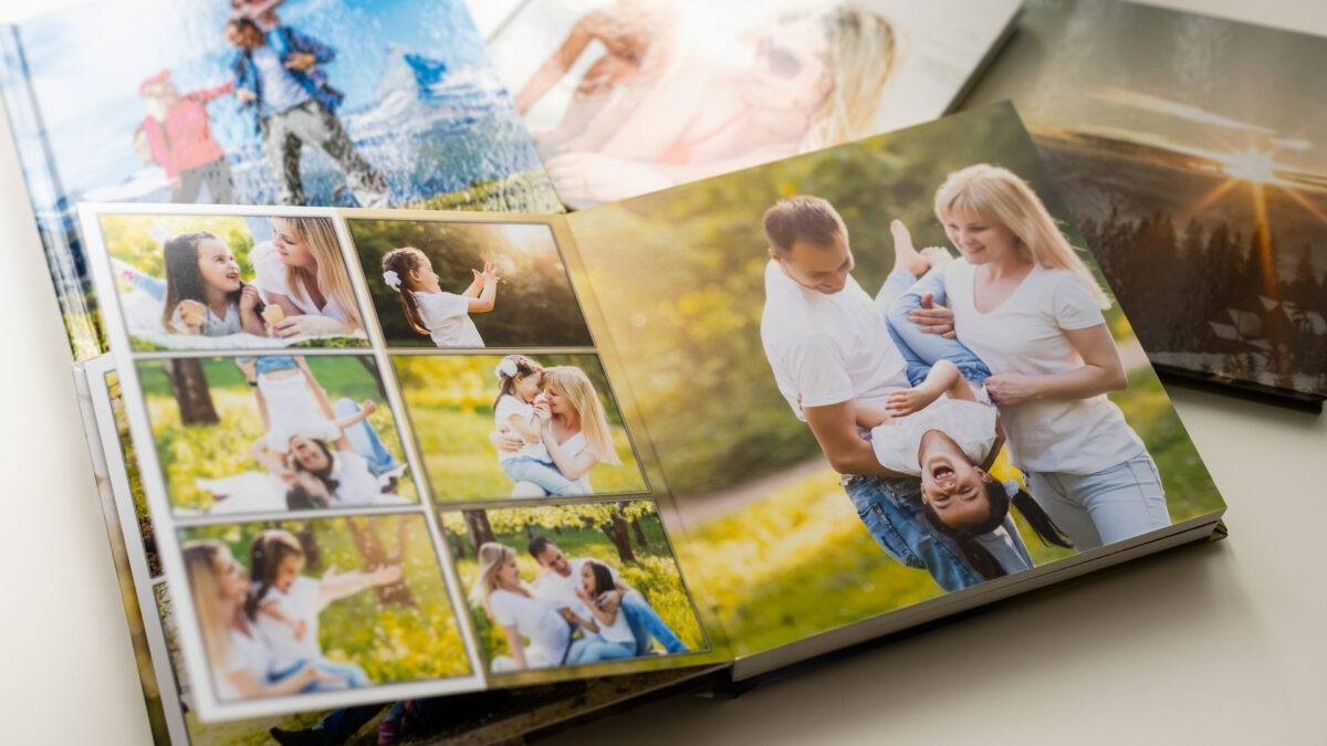 How To Store And Backup Photos Safely A Photo Book To Store And Backup Photos Of A Family Sitting On A Table.