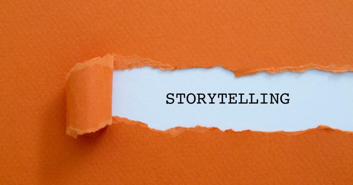 What Is A Photo Essay In Photography (13 Examples You Can Try) A Torn Piece Of Paper With The Word Storytelling Written On It, Capturing The Essence Of A Photo Essay.