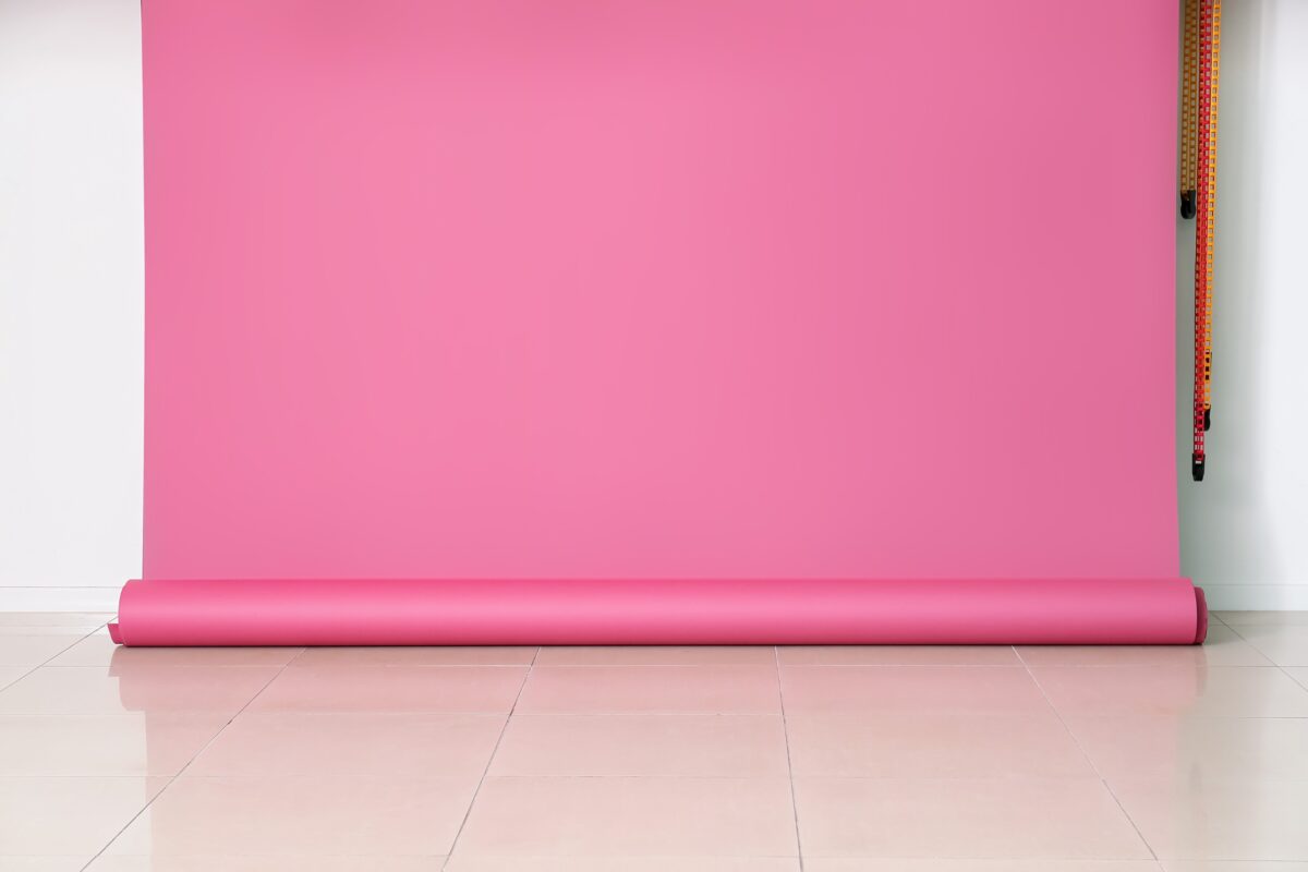The Complete Guide To Photography Backdrops A Pink Wall, Serving As A Photography Backdrop, In An Empty Room.