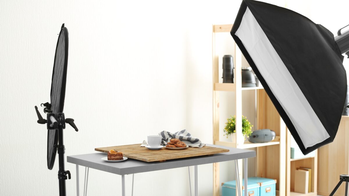 The 3 Best Photography Lighting Kits For Taking Photos A Professional Photo Studio Equipped With A Black Light And A Table, Perfect For Capturing Stunning Photographs Using The Specially Designed Photography Lighting Kit.