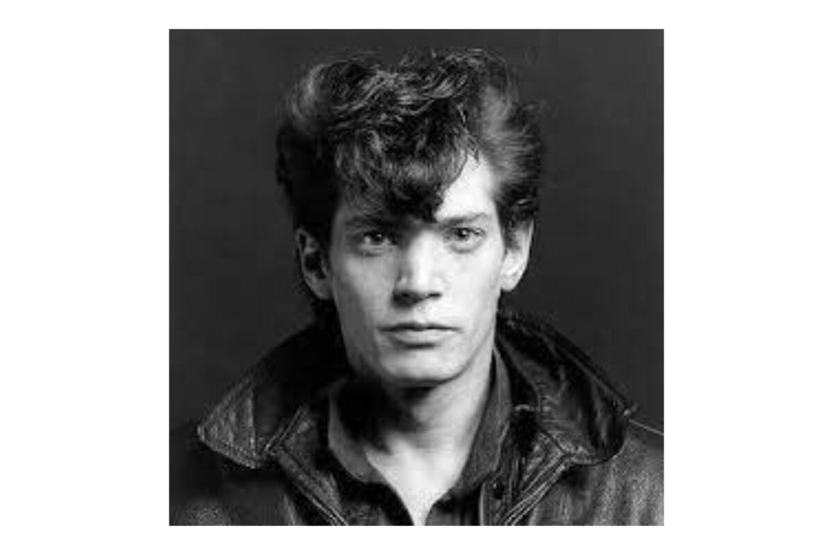 Why Photography Is An Art (My Take Take On The Matter) A Black And White Photo Of A Man In A Leather Jacket, Demonstrating Why Photography Is An Art.