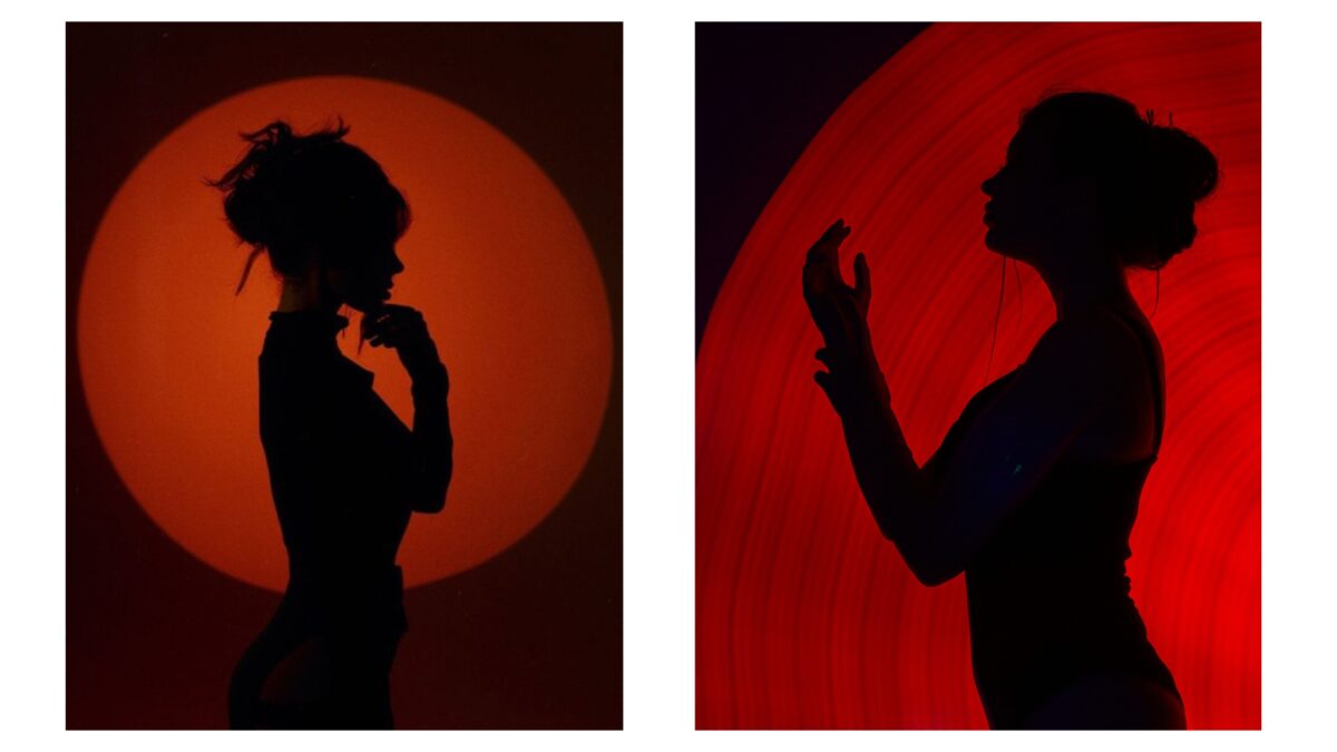 Shadow Photography (Tips And Secrets You Need To Know) Two Shadowy Silhouettes Of A Woman Standing In Front Of A Captivating Red Light.