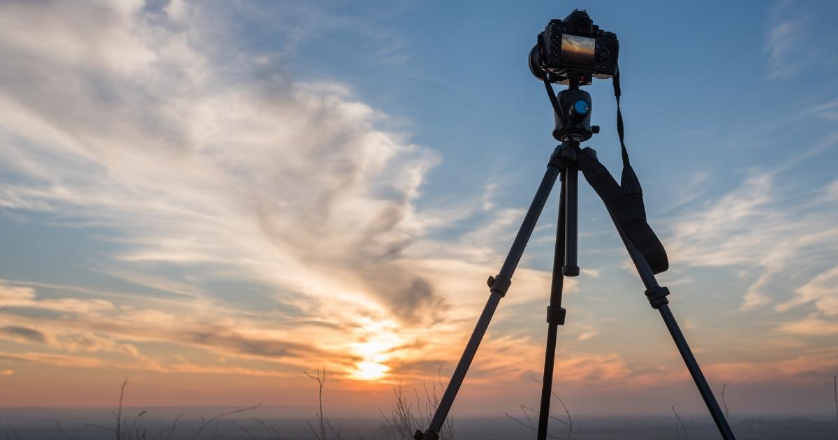 What Is Photography: An Introduction And Quick Guide A Tripod With A Camera Capturing A Sunset.