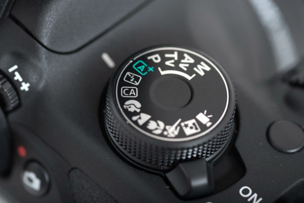 12 Mistakes Photographers Make A Close Up Of A Camera'S Shutter Button, Highlighting Common Camera Mistakes.