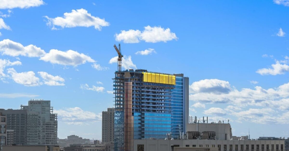 What Is A Photo Essay In Photography (13 Examples You Can Try) A Captivating Photo Essay Capturing The Essence Of A Building Under Construction Against A Beautiful Blue Sky Adorned With Fluffy Clouds.