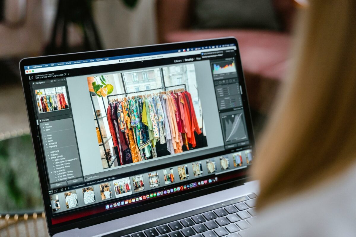 Photo Editing For Beginners (Made Easy) A Woman Is Looking At A Photo On Her Laptop While Learning Photo Editing For Beginners.