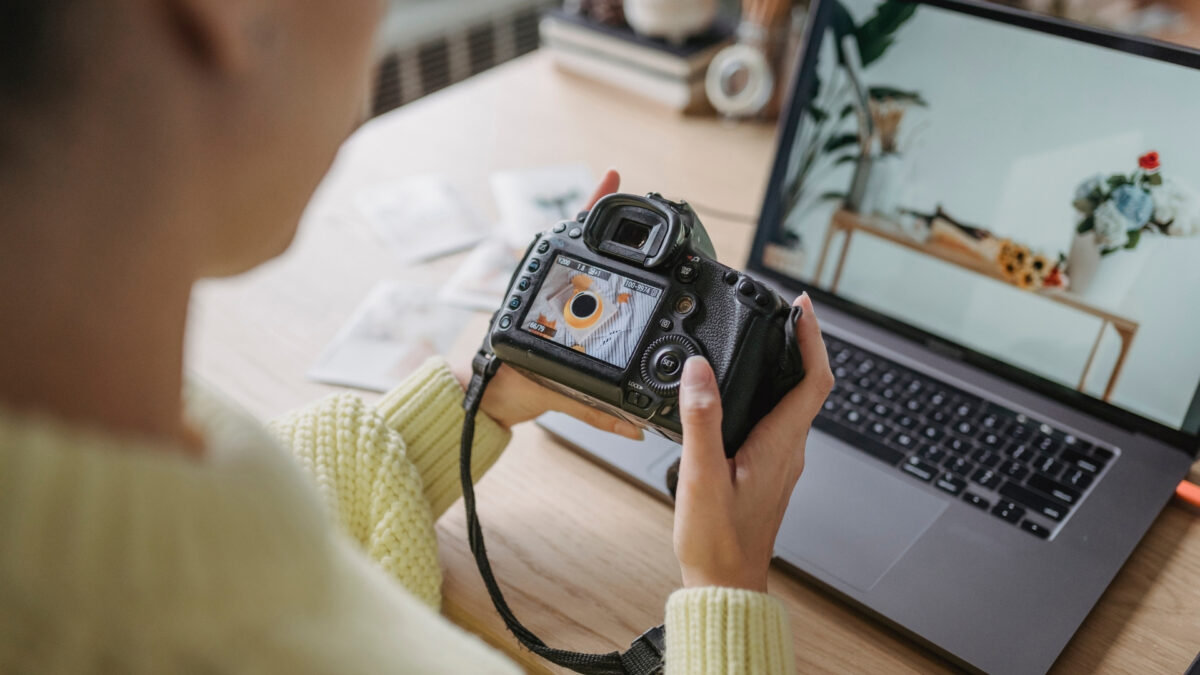 Simple Photo Editing Tips To Get Better-Looking Photos A Woman Is Using Her Dslr Camera To Store And Backup Photos On A Laptop.