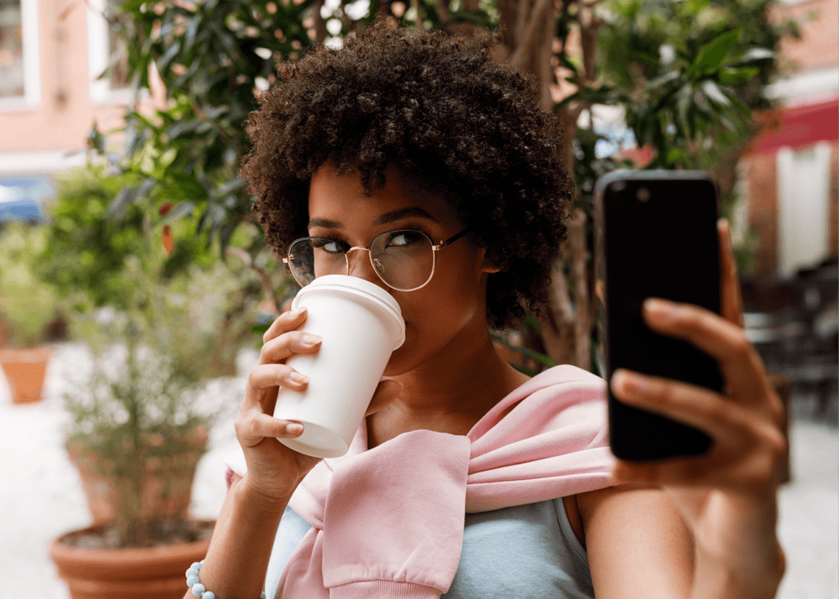 How To Use Social Media To Connect With Other Photographers Young Woman Capturing A Coffee-Focused Selfie As Part Of Her Content Marketing Strategy.